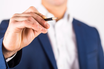 young businessman with a pencil