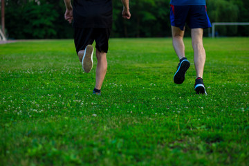 Fototapeta premium Athletic young man running in nature. Healthy lifestyle