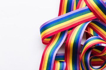 Gay pride LGBT rainbow ribbon on white background