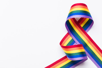 Gay pride LGBT rainbow ribbon on white background