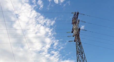 energy tower on blue sky background with clouds