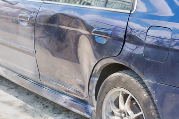 Damaged car parts after a car accident