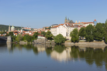 Naklejka na ściany i meble Spring Prague gothic Castle with the Lesser Town above River Vltava in the sunny Day, Czech Republic