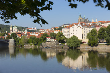Fototapeta na wymiar Spring Prague gothic Castle with the Lesser Town above River Vltava in the sunny Day, Czech Republic