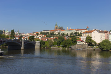 Spring Prague gothic Castle with the Lesser Town above River Vltava in the sunny Day, Czech Republic