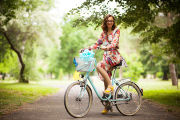 girl with vintage bicycle