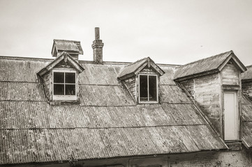 Fototapeta na wymiar Old house roof with dormers