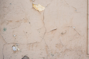 texture of battered, dirty and old brick wall and floor of various colors