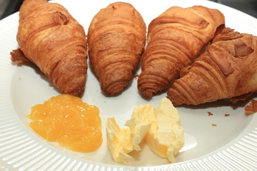 Fresh croissant and lemon curd