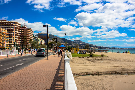 Promenade. A sunny day on the beach of Fuengirola. Malaga province, Andalusia, Spain. Picture taken – 5 june 2018.