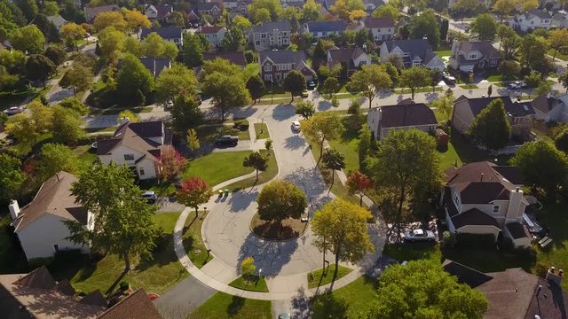 Beautiful neighborhoods, homes amid Autumn colors, aerial view.