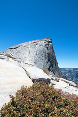 Cables with climbers on Half Dome as seen from the Sub Dome in Yosemite National Park in California United States
