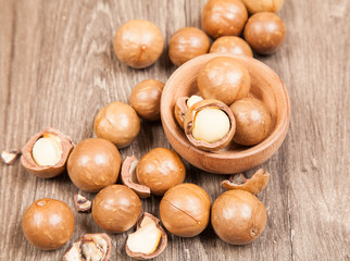 Macadamia nuts on wooden table (Macadamia integrifolia)