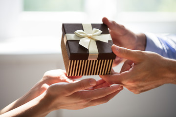 Man Giving Gift To Woman