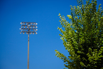 Stadium lights against Blue Sky
