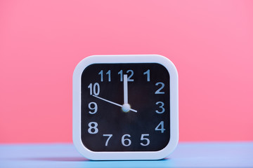 white clock on blue and pink paper , minimal style background