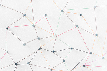 abstract web line connection of color yarn from nail node to node on white background , networking...