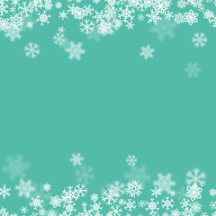 Christmas snow background with scattered snowflakes falling in winter