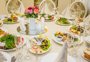 Table set for celebration in classic style with meal