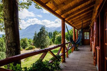 wooden cabin terrace with mountains