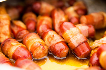 fried sausages as a snack at a buffet table