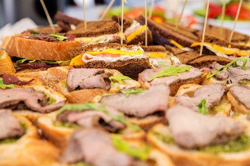 sandwiches with cheese and vegetables of triangular shape