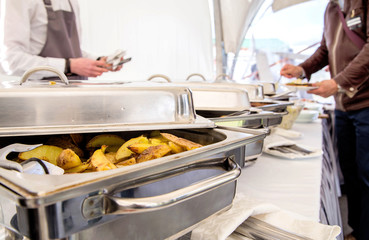 The work of the catering service. Food serving in Marmite