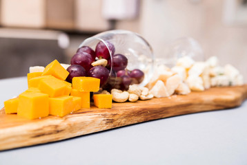 a composition from a wine glass and cheese on a buffet table