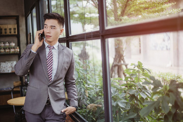 Business man working at office with laptop and documents on his desk, consultant lawyer concept