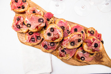 snacks with ham on a banquet table