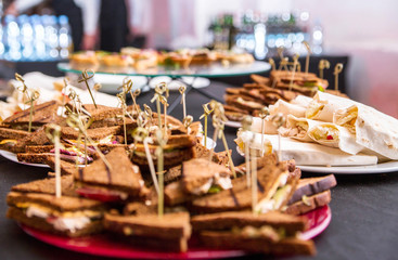 Snacks - sandwiches and pita bread on the banquet table