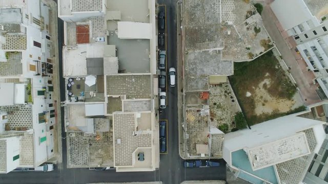 Car drive through the city in Italy Drone flight 4k