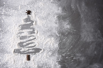 Flour on a baking sheet in a Christmas tree shape