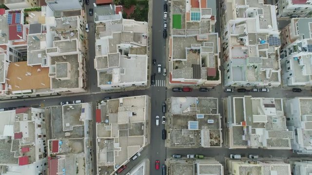 Car drive through the city in Italy Drone flight 4k