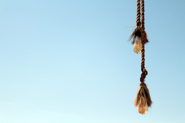 The rope and the bulb. Taken during a sunny day, with perfect blue sky in Bali,
