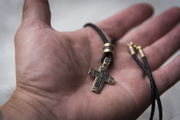 Orthodox Silver Cross on the palm.