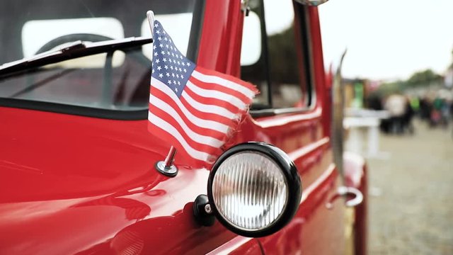 Close Side View Of Red Pickup Truck With Small American Flag Waving In Slo-mo Slow Motion