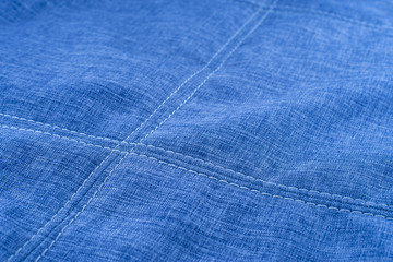Fabric texture with seam stitch seam.