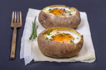 Baked potatoes stuffed with cheese and egg