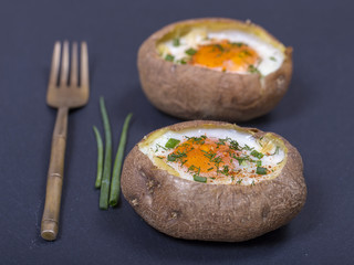 Baked potatoes stuffed with cheese and egg