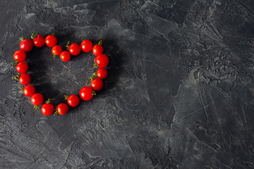 Heart of a cherry tomato on a concrete with a copy of the space