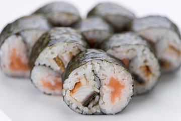 Sushi set and composition at white background. Japanese food restaurant, sushi maki gunkan roll plate or platter set.