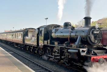 Obraz na płótnie Canvas Steam engine on North Norfolk Railway at Sheringham station