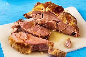 Pork neck meat on kitchen board.