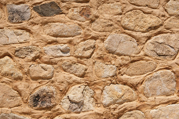 Old stone wall background texture closeup