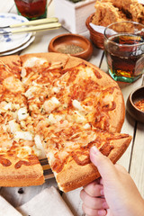 Delicious fresh pizza with seafood on wooden table.     