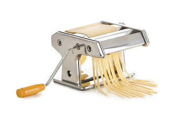 Metal pasta machine with dough on white background
