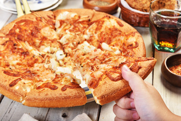 Delicious fresh pizza with seafood on wooden table.     