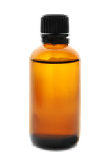 Bottle of citrus essential oil on white background