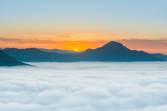 sunrise over mountain with fog 
